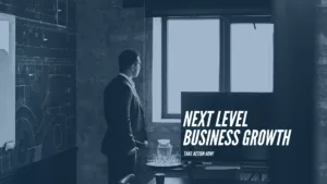 Man looking out of his office window thoughtfully. Text over image reads: Next Level Business Growth