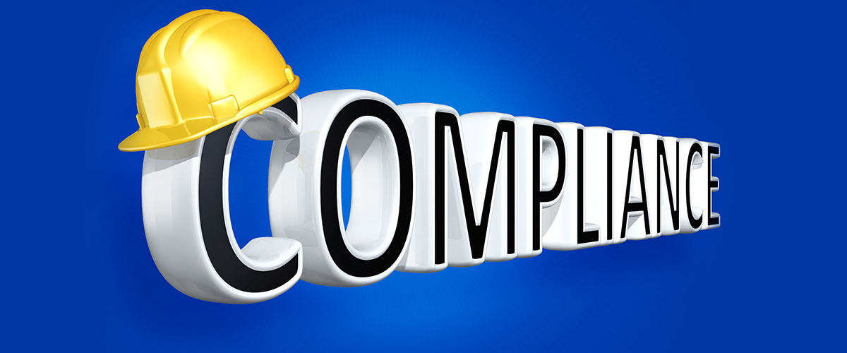 The word compliance with a hard hat on top of the letters